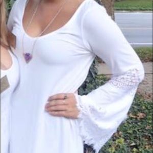 White dress with bell lace sleeves